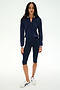 A person wearing the SPLITS59 Bonnie Knit Half Zip in Indigo/White stands against a plain white background.