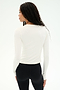 A person with long, wavy hair is seen from behind, wearing the SPLITS59 Airweight Lite Long Sleeve Waist Length tee in white and black leggings, standing against a plain white background.