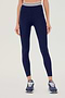 Front view of girl wearing a dark blue leggings with white and blue waistband and dark blue shoes
