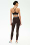 A person wears the SPLITS59 Bailey High Waist Active Rib 7/8 leggings in Heather Dark Chocolate, facing away against a plain light background—ideal activewear for gym workouts.