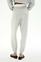 A person wears SPLITS59's Andie Dual Waist Sweatpant in Heather Grey/White with an elastic waist and cuffs, paired with black flats and a cropped gray long-sleeve top, standing on a white background.