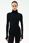 A woman faces forward against a white background, wearing the SPLITS59 Jackson Rib Full Length Turtleneck in Black/White with matching black pants.