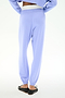 Model showcases the SPLITS59 Andie Dual Waist Sweatpant in Purple Haze/White from the back, featuring a stretchy fit and dual-tone waistband, styled with black slip-on shoes against a white background.
