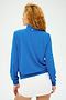 Person with long curly hair, wearing a SPLITS59 Max Rigor Track Jacket in Classic Blue/White and a white skirt, facing away.