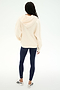 A person stands facing away against a plain white background, wearing the SPLITS59 Stella French Terry Oversized Hoodie in Creme, made from 100% cotton, paired with navy leggings and white athletic shoes.