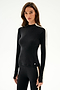 Woman wearing the SPLITS59 Isabelle Airweight Lite Mock Neck - Black/Creme with matching black leggings, standing on a plain white background.