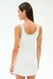 A woman with long brown hair wears the SPLITS59 Martina Rigor Color Block Dress in White/Spearmint, standing with her back to the camera against a plain light background—perfect for court sports or high-impact workouts.