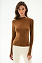 Model wears the Isabelle Airweight Lite Mock Neck - Toffee/Creme by SPLITS59 with cream pants, standing against a plain white background.