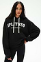 A woman is wearing the SPLITS59 Stella French Terry Oversized Hoodie in black with "Splits59 Los Angeles" text, paired with black leggings featuring white side stripes and white drawstrings, as she stands against a plain white background.