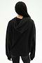 A person stands with their back to the camera against a plain light background, wearing the SPLITS59 Stella French Terry Oversized Hoodie in black and black leggings.