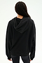 A person stands with their back to the camera against a plain light background, wearing the SPLITS59 Stella French Terry Oversized Hoodie in black and black leggings.