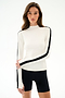 Woman wearing the SPLITS59 Isabelle Airweight Lite Mock Neck - White/Black with black shorts, standing against a plain white background.