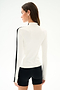 A woman with long brown hair models the SPLITS59 Isabelle Airweight Lite Mock Neck - White/Black, shown from the back against a plain white background.