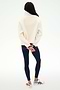 A person stands with their back to the camera, wearing the SPLITS59 Reese Sherpa Half Zip Pullover in Creme/Indigo, paired with navy leggings and white sneakers. Their hands are clasped behind their back against a plain white background.