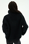 A person stands with their back to the camera, wearing the SPLITS59 Reese Sherpa Half Zip Pullover in black—crafted from 100% polyester—paired with black leggings, set against a plain white background.