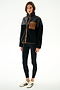 Woman wearing the SPLITS59 Skylar Sherpa Jacket - Black/Toffee with black leggings and white sneakers, standing against a plain white background.