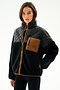 Person wearing the SPLITS59 Skylar Sherpa Jacket - Black/Toffee, a black and brown zip-up with high collar, made from 100% polyester, against a white background.