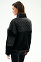 Woman in profile wears the SPLITS59 Skylar Sherpa Jacket - Black/Toffee, featuring a high collar, with black leggings against a plain white background.