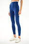 Person wears SPLITS59 Hayley Active Rib 7/8 - Heather Cobalt/White leggings and white sneakers, standing against a plain white background.