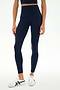 A person wearing SPLITS59 Sprint High Waist Rigor 7/8 leggings in Indigo, crafted from soft Rigor fabric, paired with a matching crop top and white sneakers, stands against a plain white background.
