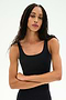 A person with long braided hair stands against a plain light background, arms crossed, wearing the SPLITS59 Sprint Rigor Bralette in black—an athletic crop tank designed for multisport performance.