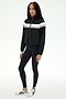 A person is wearing the SPLITS59 Morrison Nylon Twill Track Jacket in Black/Creme, paired with black spandex leggings and white sneakers, standing against a plain white background.