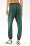 Person wearing SPLITS59 Andie Oversized Fleece Sweatpant in Military and white sneakers with green stripes, shown from the back on a plain white background—ideal for cool weather workouts or laid-back days.