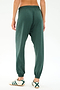 Person wearing SPLITS59 Andie Oversized Fleece Sweatpant in Military and white sneakers with green stripes, shown from the back on a plain white background—ideal for cool weather workouts or laid-back days.