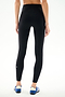 Model wears SPLITS59 Clare High Waist Rigor 7/8 - Black/Cobalt leggings and blue running shoes, standing on a white background, shown from the back.
