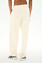 A person wearing the SPLITS59 Serena French Terry Oversized Sweatpant in Creme/59 and white sneakers, shown from the back against a plain white background.