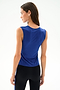 A woman with long brown hair models the SPLITS59 Nikki Jersey Tank - Cobalt, standing and facing away against a plain light background.