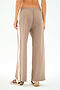 Model wears SPLITS59 Willow Airweight Wide Leg pants in Latte/White with maroon and white sneakers, shown from the back against a plain background.