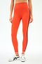 A person wears SPLITS59 Ella High Waist Airweight 7/8 leggings in Valencia/Indigo with white athletic shoes, standing against a plain background.