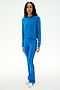 A person stands facing forward, wearing the SPLITS59 Brooks Fleece Long Sleeve Sweatshirt in Classic Blue paired with matching blue pants featuring black side stripes, crafted from a comfortable modal spandex blend, and white sneakers, against a plain white background.