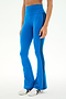 A person wearing the SPLITS59 Raquel High Waist Supplex Flare leggings in Classic Blue/Indigo, featuring black side stripes and white sneakers, stands against a plain background. These high-rise workout pants offer 4-way stretch for ultimate comfort and ease of movement.