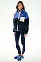 A woman stands in the SPLITS59 Skylar Sherpa Jacket - Indigo/Cobalt, featuring a white pocket, navy leggings, and blue sneakers against a white background.