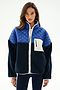 Woman wearing the SPLITS59 Skylar Sherpa Jacket - Indigo/Cobalt, featuring quilted and sherpa panels, white zipper, and chest pocket, against a plain white background.
