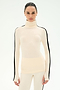 A woman models the SPLITS59 Jackson Rib Full Length Turtleneck in Creme/Black, featuring black stripes down the sleeves and crafted from a soft modal blend for ultimate comfort, standing against a plain white background.