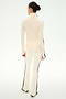A person stands facing away against a white background, wearing the SPLITS59 Raquel High Waist Supplex Flare in Creme/Black—a cream pair of high-waisted flare leggings with black side stripes, crafted from 4-way stretch fabric.