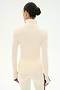 A person with dark hair styled in a bun is shown from the back against a plain white background, wearing the SPLITS59 Jackson Rib Full Length Turtleneck in Creme/Black, paired with matching pants; both pieces are crafted from soft modal blend fabric and feature long sleeves and a contemporary fit.