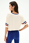 Woman wearing the Djuna Oversized Crop Jersey Tee - Creme/Cobalt by SPLITS59, shown from the back against a plain background.