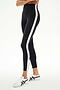 Wearing the SPLITS59 Clare High Waist Rigor 7/8 leggings in Black/White—a high-waisted style with a striking white side stripe and crafted from performance-driven Rigor fabric—this look is completed with white sneakers against a plain background, delivering both gym-ready function and modern style.