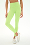 A person wearing the SPLITS59 Clare High Waist Rigor 7/8 leggings in Limeade/White, crafted from a soft nylon spandex blend, paired with white sneakers and standing with legs crossed against a plain background.
