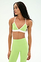 A woman stands against a plain white background wearing the SPLITS59 Sage Rigor Bra in Limeade/White, paired with matching high-waisted leggings.