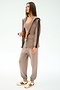 Woman wearing the SPLITS59 Reggie Water Repellent Jacket in Latte/Black, styled with matching joggers, a crop top, and beige sneakers against a plain light background.