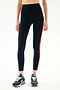 SPLITS59 Ella High Waist Airweight 7/8 - Indigo/Valencia dark navy leggings with thin orange side stripes and navy sneakers.
