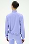 A person with dark hair in a bun is seen from the back, wearing the SPLITS59 Lyle Woven Nylon Pullover in Purple Haze/Creme, paired with matching leggings, against a plain white background.