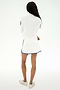 Person stands with arms crossed, facing away, wearing a white long-sleeve top, SPLITS59 Ozzie Rigor Skort in White/Cobalt, and white athletic shoes—ideal for court sports or gym workouts.