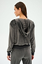 A person embodies comfort and versatility by wearing the SPLITS59 Rhys Velour Zip Up Hoodie in Graphite, facing away.