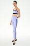 A person wears the SPLITS59 Emerson Airweight Bra in Purple Haze/Black, paired with matching high-waisted leggings featuring side stripes and black ballet flats.